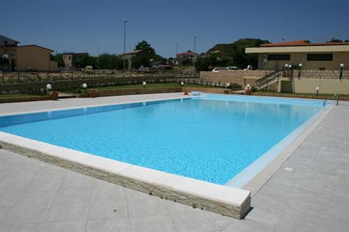 Baia Dei Canonici Aparthotel Villaggio Le Rocelle Exterior photo